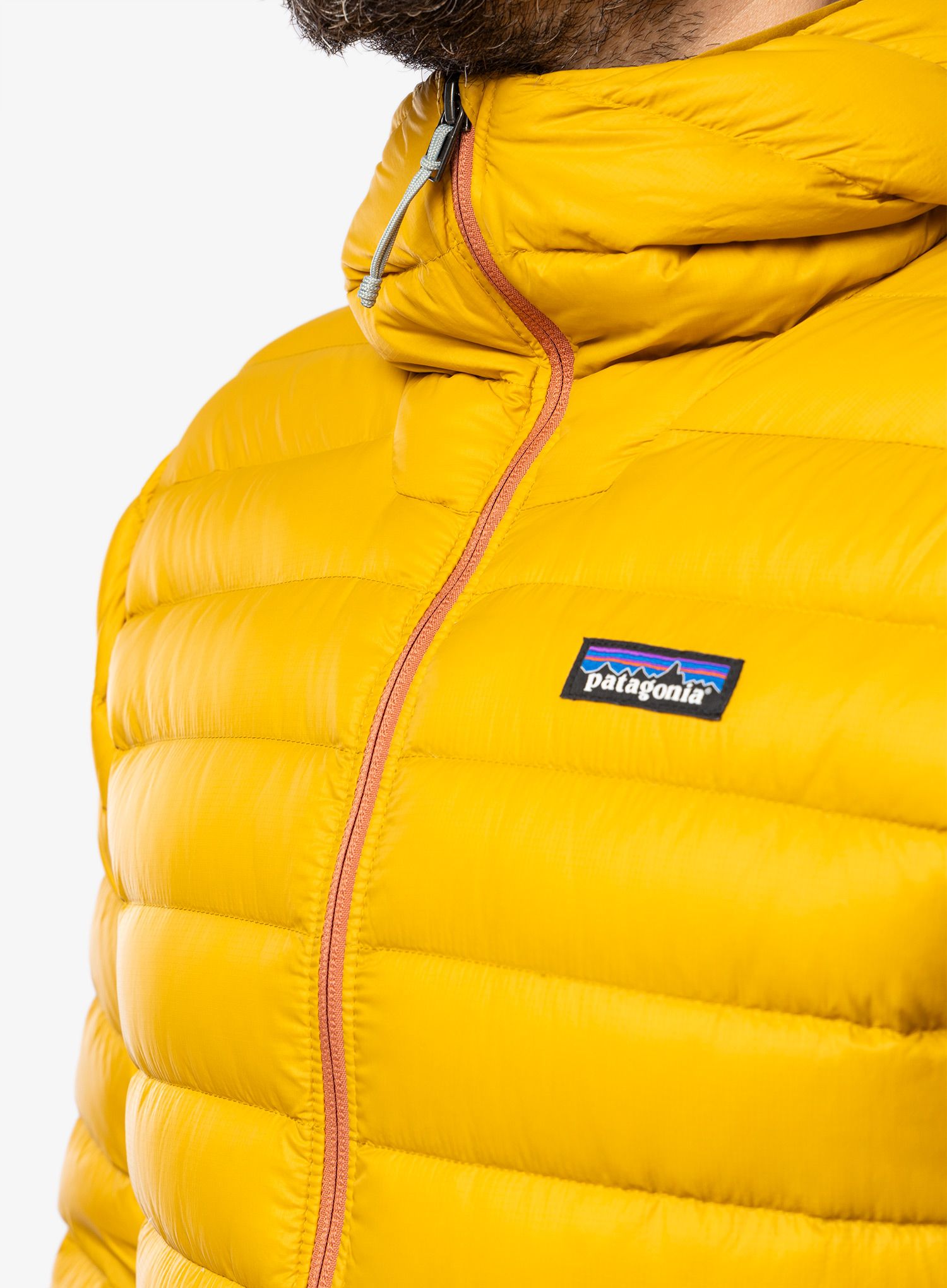 Péřová bunda pánská Patagonia Down Sweater Hoody - cosmic gold