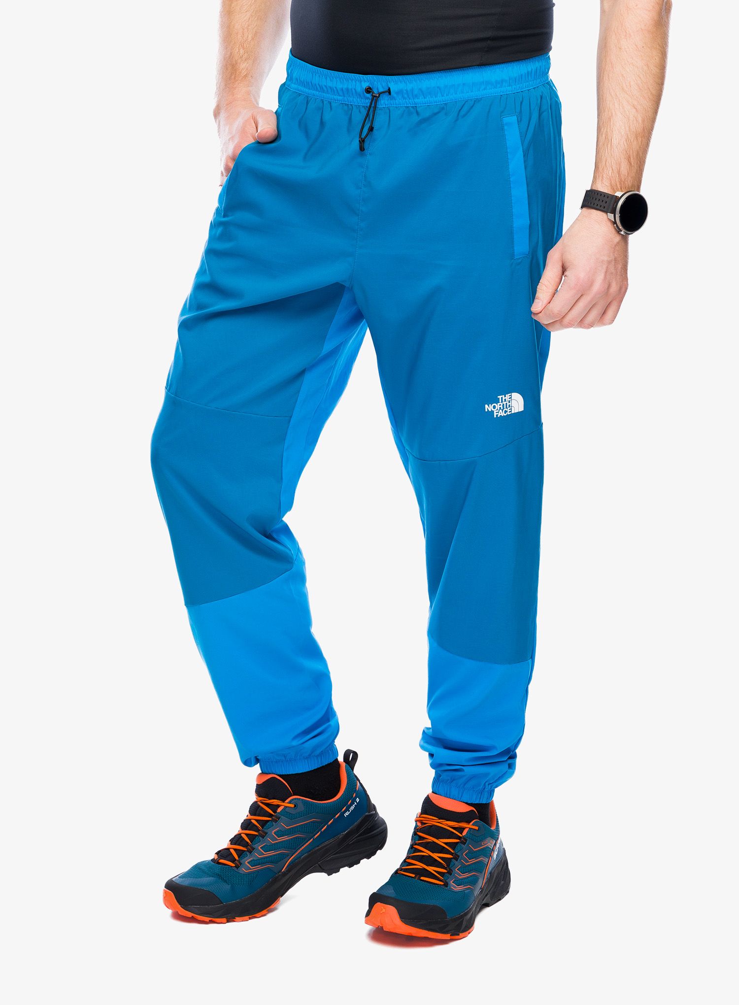 Turistické kalhoty The North Face Ma Wind Track Pant - skyline blue/adriatic