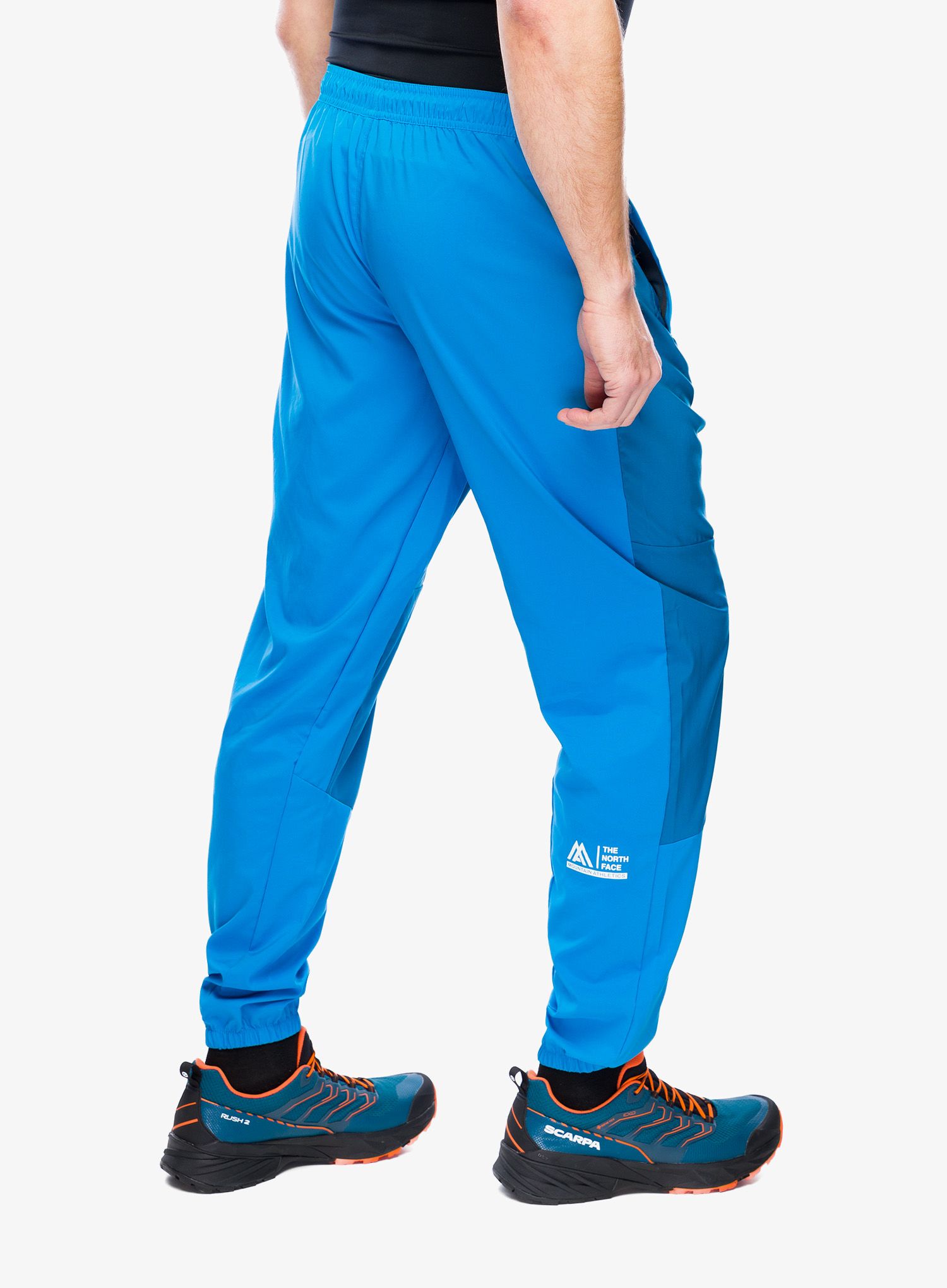 Turistické kalhoty The North Face Ma Wind Track Pant - skyline blue/adriatic